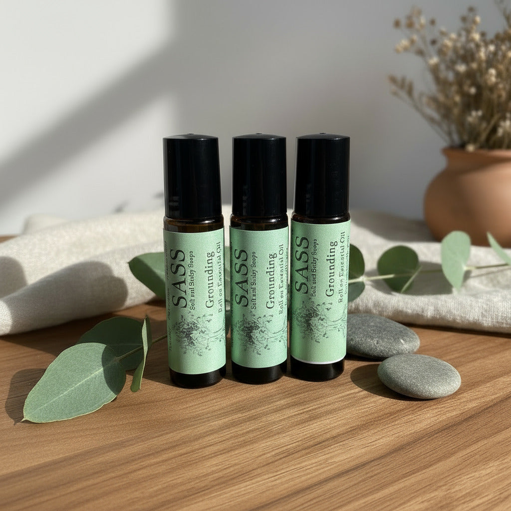Three essential oil roller with green labels on a white background