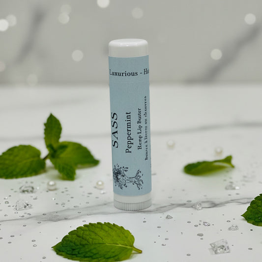 Lip balm tube with blue label on a gray background