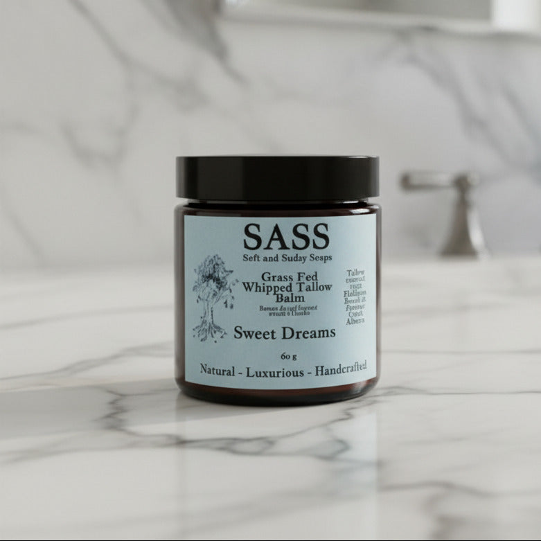 Balm jar labeled 'SASS' with a black lid on a white background