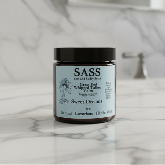 Balm jar labeled 'SASS' with a black lid on a white background